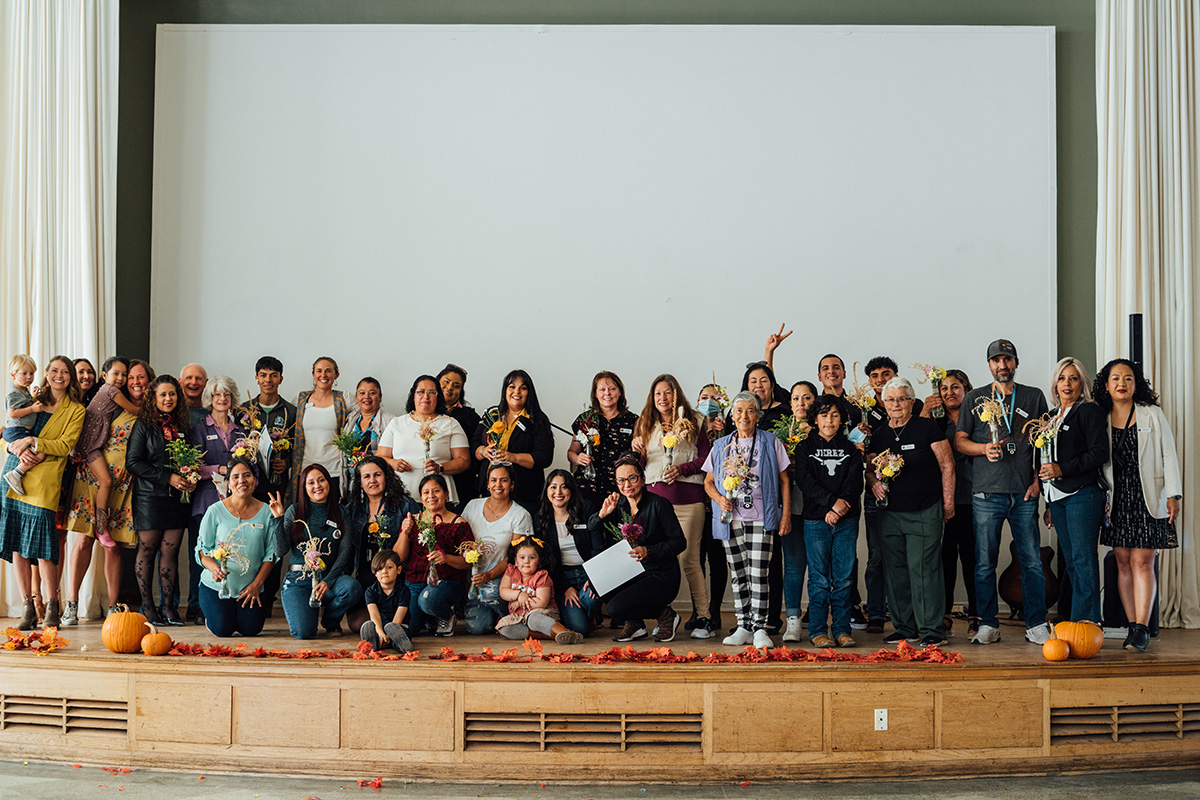 a group of people on a stage inside a building