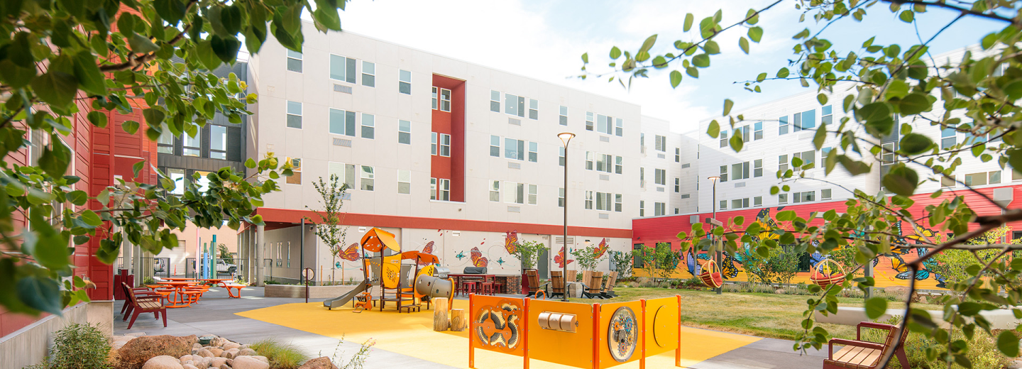 courtyard with playground, white and red building background