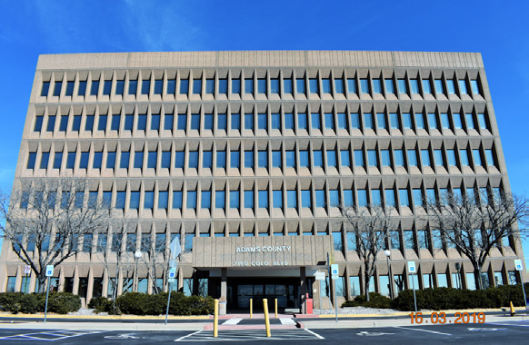 front view of building with uniform windows, 6 stories