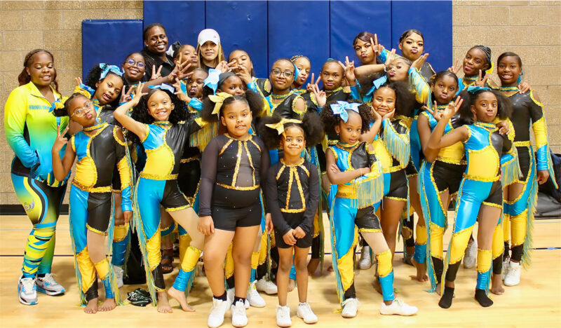 Group of young girls in matching colorful uniforms