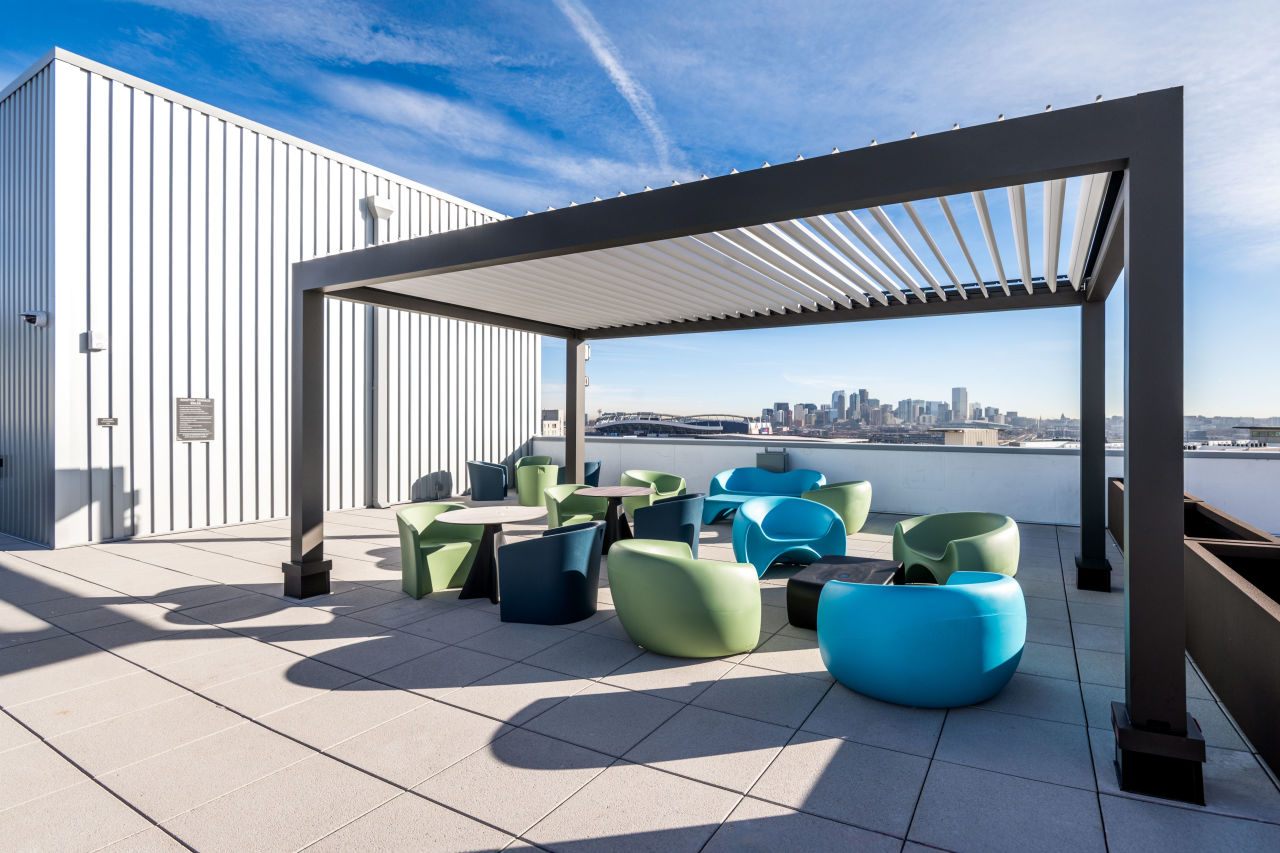 rooftop patio with Denver skyline in the background