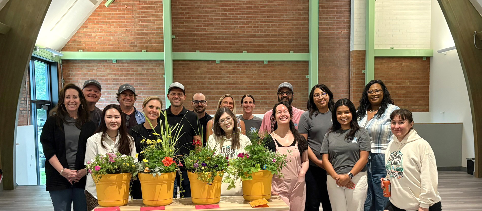 ULC staff team standing with plants