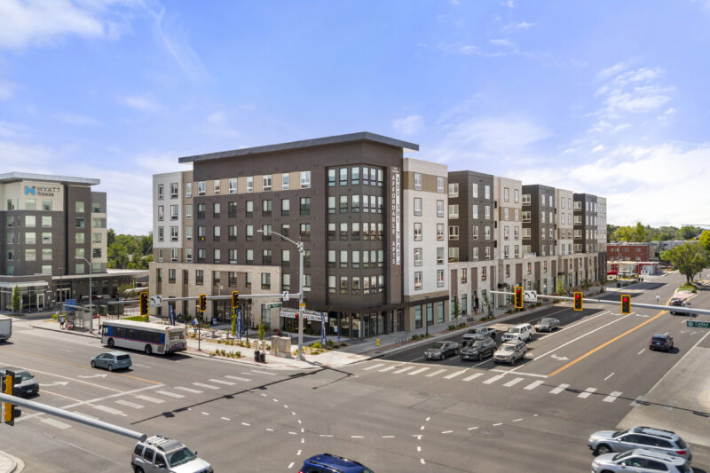 A six-story apartment building at an intersection in Aurora, Colorado